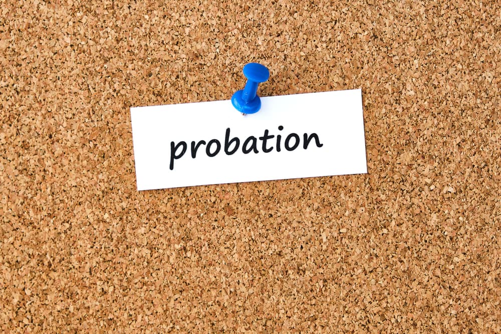 Probation - term written on paper pinned to a cork board.