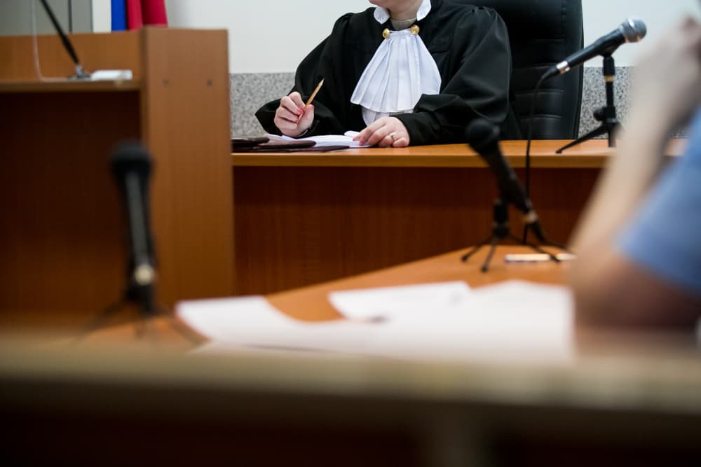 Lawyers listening to the judge in the court room