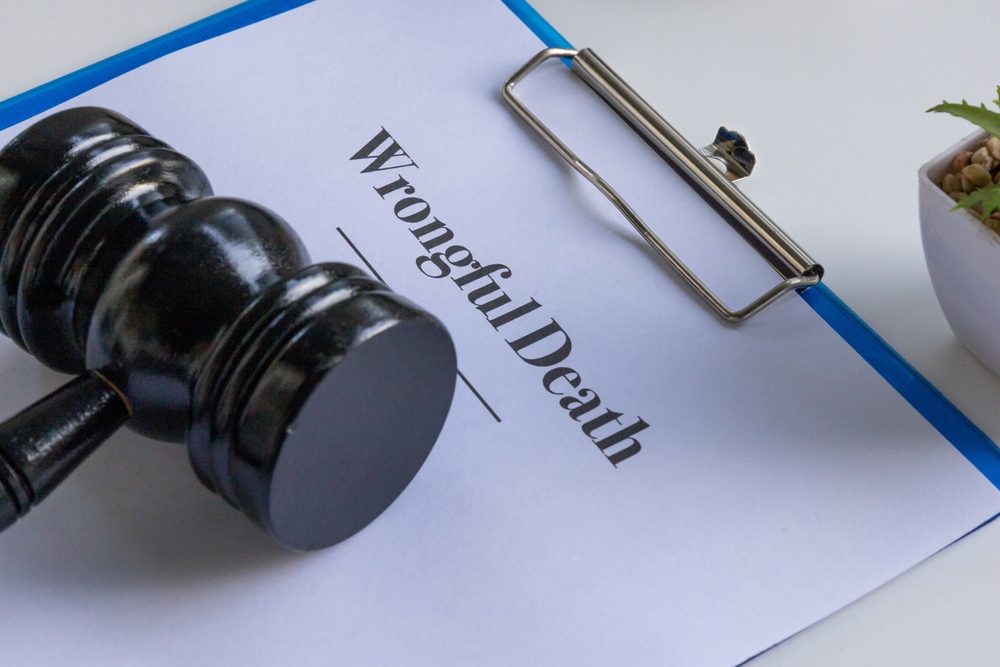 Gavel resting on a wrongful death document representing personal injury litigation