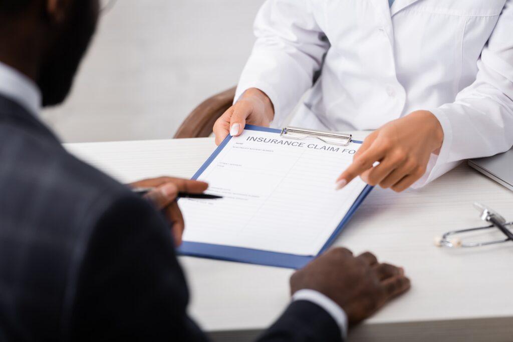 Insurance claim form and pen on a desk